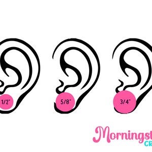 a drawing of a pair of ears with a pink ball in the middle