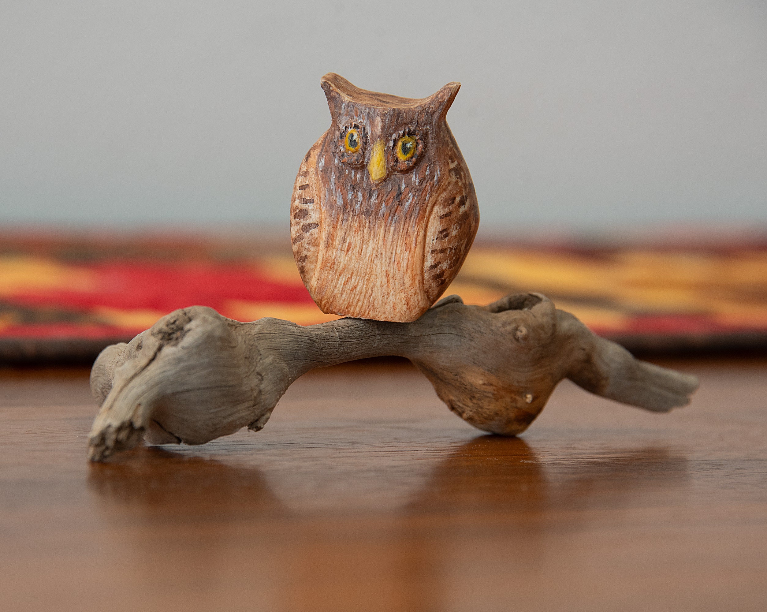Carved and hand-painted Owl mounted on found wood, measures about 2.75 inches high