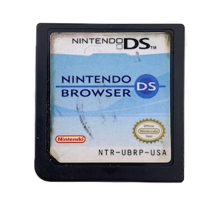 May include: A black Nintendo DS game cartridge with a blue and white label that says "Nintendo DS Browser". The cartridge has a Nintendo logo and the text "NTR-UBRP-USA".