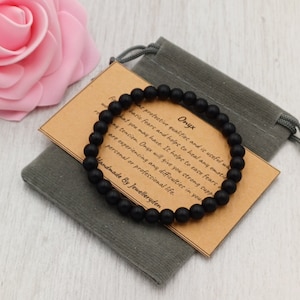Pulsera elástica de ÓNIX NEGRO MATE hecha a mano con bolsa de regalo y tarjeta de piedras preciosas de cristal de 6 mm