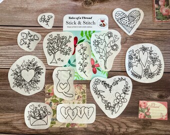 May include: A set of ten black and white iron-on transfer designs featuring hearts, flowers, and a cat. The designs are printed on water-soluble stabilizer and are perfect for embroidery projects. The designs are called "Tales of a Thread Stick & Stitch".
