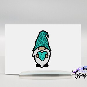 May include: A teal gnome with a leopard print hat holding a teal heart with the letter C inside. The gnome is outlined in black.