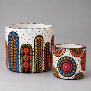 hand-painted cylindrical clay pot