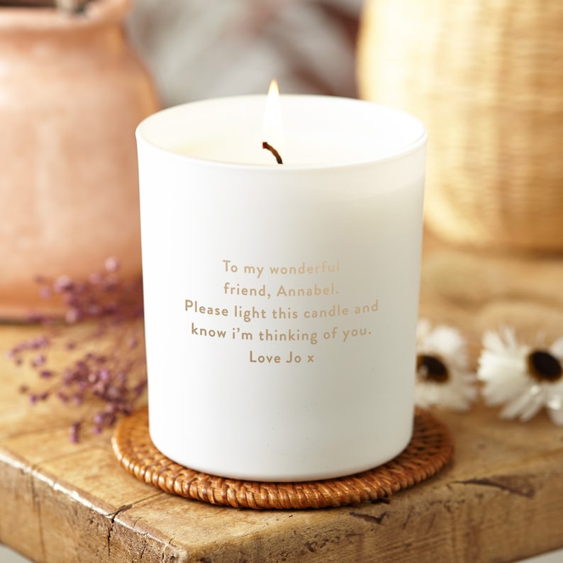May include: White candle with a gold inscription that reads "To my wonderful friend, Annabel. Please light this candle and know I'm thinking of you. Love Jo x".