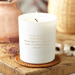 May include: White candle with a gold inscription that reads "To my wonderful friend, Annabel. Please light this candle and know I'm thinking of you. Love Jo x".