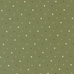 May include: A green fabric with a white polka dot pattern. The fabric has a subtle texture.