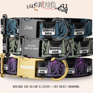 May include: Three dog collars with a Bigfoot and forest pattern, featuring black and gold buckles engraved with names like Bella, Shasta, and Tucker, and phone numbers. Each collar includes a white patch with the text SERVICE DOG.