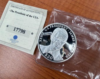 Moneda de plata de 20 dólares de la República de Liberia del año 2000, conmemorativa del presidente Jimmy Carter.