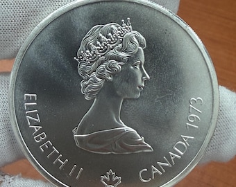Juegos Olímpicos de Montreal, Canadá 1973. Plata fina 92,5%, 1,4 onzas troy, 10 dólares, mapa del mundo.