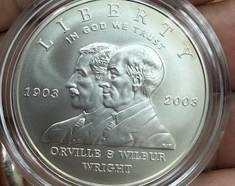 Moneda conmemorativa de dólar de plata al 90% del primer vuelo de Wilber y Orville Wright de 2003