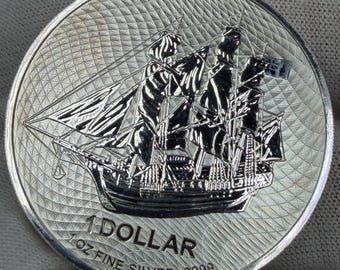 Moneda de plata de 1 dólar de 2022 de las Islas Cook, con la imagen de un velero y la imagen de un barco de vela (1 onza). Sin circular.
