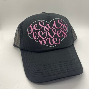 Black Trucker Hat “Jesus Loves Me”