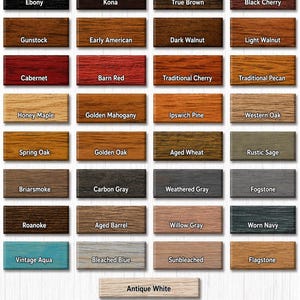 Op de afbeelding: Een kleurenkaart met Verathane houtbeitskleuren. De kaart toont rechthoekige blokken in verschillende tinten, waaronder Ebony, Kona, True Brown en Black Cherry. Andere kleuren zijn Cabernet, Barn Red en Vintage Aqua.