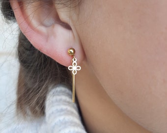 Stainless steel studs with bar and flower pendant.
