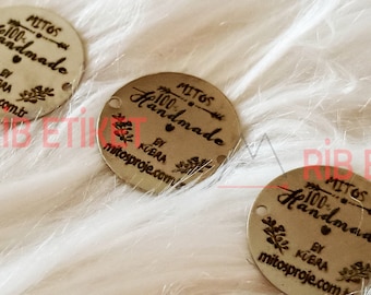 May include: Three round, silver metal tags with the text "MITOS 100% Handmade by KUBRA mitosproje.com.tr" engraved on them.