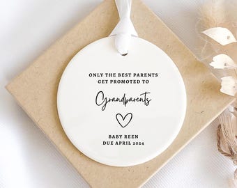 May include: White ceramic ornament with black text that reads "Only the best parents get promoted to grandparents" with a heart symbol and "Baby Reen Due April 2024".