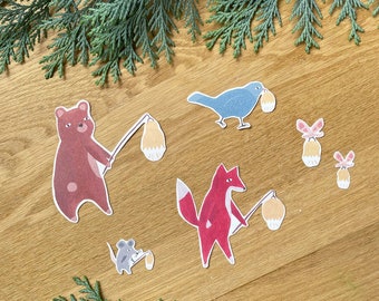 May include: A set of five illustrated animal stickers with lanterns. The animals include a bear, a fox, a bird, and two mice. The stickers are on a wooden background.
