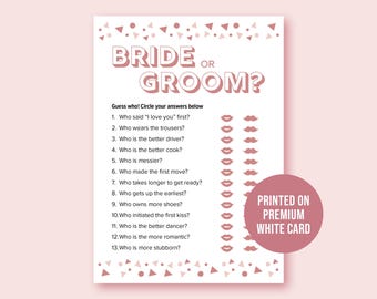 May include: A white card printed with the text "BRIDE OR GROOM?" in pink. The card is a game with questions to guess who said "I love you" first, who wears the trousers, and more. A pink circle says "PRINTED ON PREMIUM WHITE CARD."