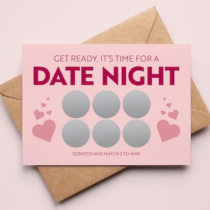 May include: A pink scratch card with the words "DATE NIGHT" in magenta, decorated with hearts and six silver scratch-off circles. The card rests on a brown envelope, with the text "GET READY, IT'S TIME FOR A" and "SCRATCH AND MATCH 3 TO WIN!"