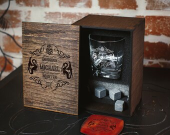 May include: A wooden box with a glass and ice stones inside. The box is engraved with the text "Dungeon Master Michael".