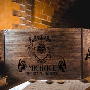 May include: A wooden Dungeon Master's screen with a personalized inscription "MICHAEL Dungeon Master" and a coat of arms featuring a 20-sided die.