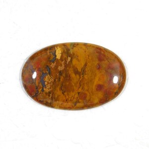 May include: A smooth, oval-shaped cabochon gemstone with a brown, orange, and red color pattern. The stone has a polished, glossy finish.