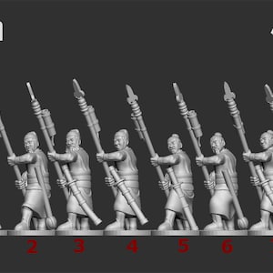 May include: A collection of eight miniature figures of ancient warriors, each holding a spear. The figures are gray and stand on a base. The text "28mm" is at the top left, and the "Ten Kingdoms" logo is at the top right.
