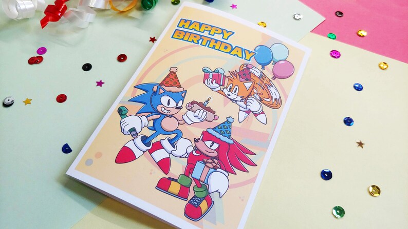 sonic birthday card with sonic, tails, and knuckles. Card says happy birthday on front.