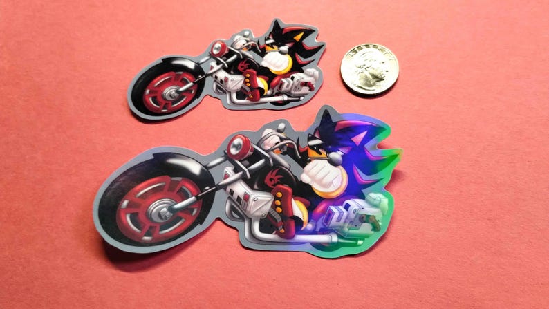 Holographic and glossy shadow the hedgehog riding a motorcycle stickers next to quarter for measure