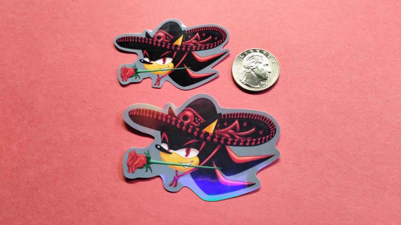 Holographic and glossy shadow the hedgehog loving latinas stickers next to quarter for measure