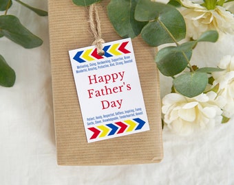 May include: A brown gift box with a white tag that says "Happy Father's Day". The tag has red, yellow, and blue arrows on the top and bottom. The tag also lists positive adjectives describing a father.