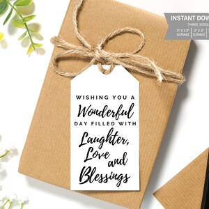 May include: White gift tag with black text that reads "Wishing you a Wonderful Day Filled With Laughter, Love and Blessings".