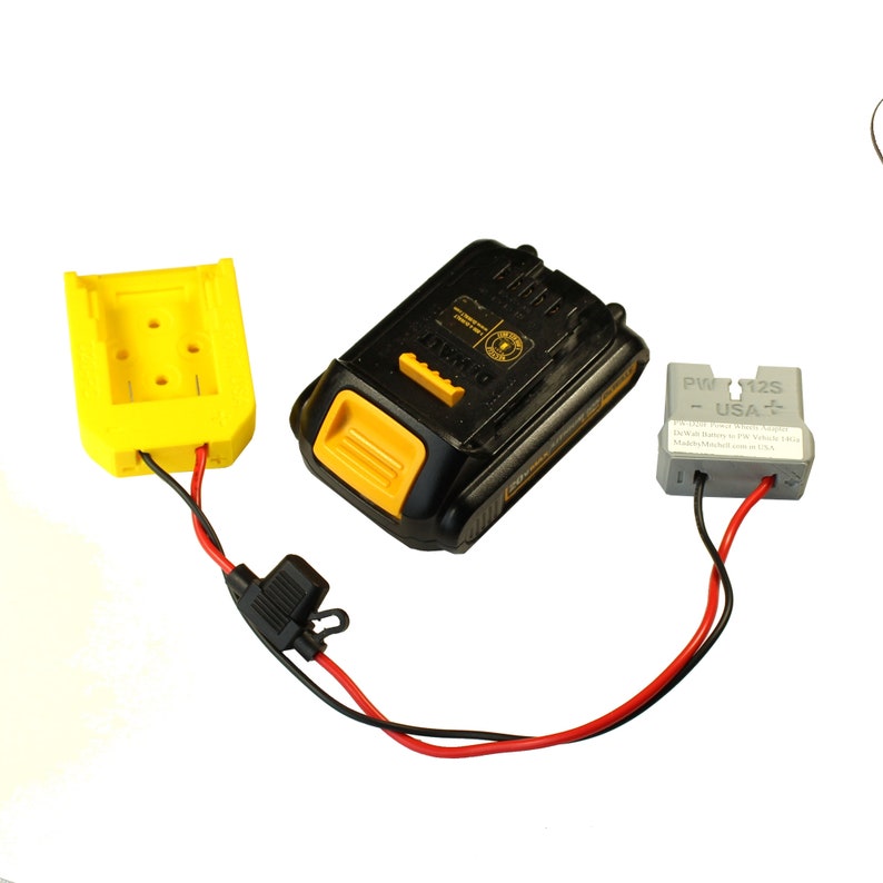 May include: A black and yellow power tool battery with a yellow plastic case, a black and red wire with a black connector, and a gray power adapter with the text "PW 12S USA+" on it.
