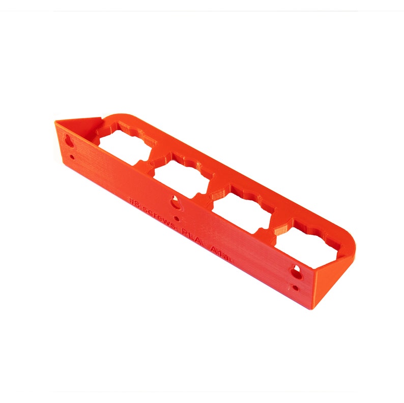May include: A red plastic wall mount with four slots for holding screws. The mount has the text "#8 screws PLA A14" printed on it.