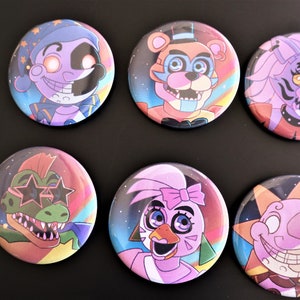 May include: A collection of seven round pinback buttons featuring colorful cartoon character designs. The buttons showcase various characters with vibrant colors and detailed illustrations, set against a rainbow or starry background. The buttons are arranged on a black surface.
