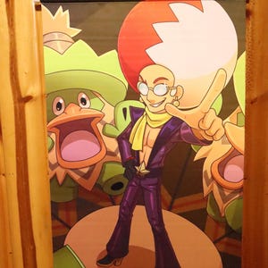 May include: A wall scroll featuring a cartoon illustration of a character in a purple suit with a yellow scarf, glasses, and a large white and red hairstyle. The background includes other cartoon characters in green and orange.