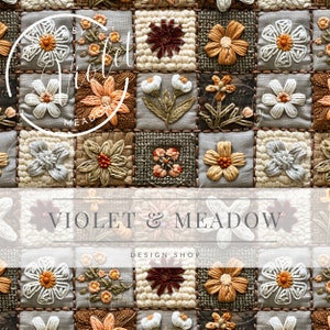 May include: A close-up of a fabric wall hanging with a patchwork design featuring embroidered flowers in various colours and styles. The fabric is a light beige colour and the flowers are in shades of brown, orange, white, and red. The text "VIOLET & MEADOW DESIGN SHOP" is printed in white on a white banner below the fabric.