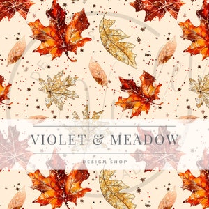 May include: A seamless pattern featuring gold and orange glitter leaves on a cream background. The leaves are arranged in a random pattern and are surrounded by small gold stars. The text "VIOLET & MEADOW DESIGN SHOP" is centered at the bottom of the image.