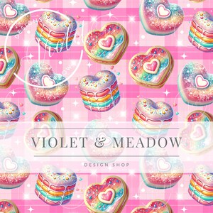 May include: A pink and white gingham background with a repeating pattern of heart-shaped cookies and cakes decorated with rainbow sprinkles and glitter. The text "VIOLET & MEADOW DESIGN SHOP" is in the centre of the image.