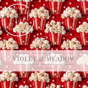 May include: A red felt background with a repeating pattern of white popcorn in red and white striped containers. The containers have a gold ribbon and white pearl accents. The text "Designs by Violet & Meadow" is at the top and bottom of the image.