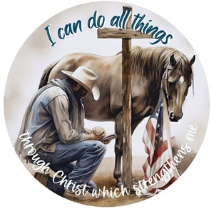 May include: A watercolor painting of a cowboy kneeling in prayer with his horse beside him. The horse is draped with an American flag. A wooden cross stands behind them. The text "I can do all things through Christ which strengthens me" is written around the image.