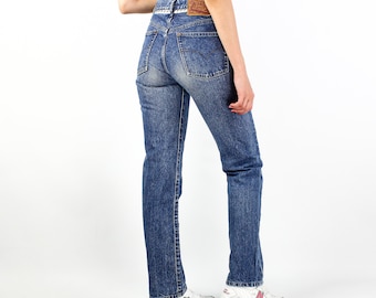 90s Vintage women's DIESEL blue stonewashed button fly mom jeans Size 28 made in Italy baggy style high waist
