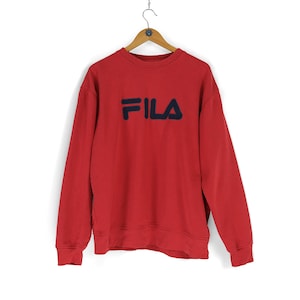 Può includere: Felpa a maniche lunghe rossa con logo FILA blu navy sul davanti.