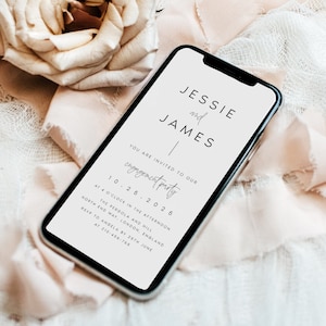 May include: A white smartphone with a black screen displaying a wedding announcement for Jessie and James. The announcement includes the date 10.26.2026 and the location of the engagement party: The Pergola and Hill, North End Way, London, England. RSVP to Angela by 28th June at 210-456-765.