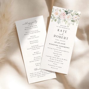 May include: Two white wedding programme cards featuring a watercolour floral illustration of pink roses and green eucalyptus leaves at the top. The text includes the names Kate and Robert, the date 26.06.2026, Paris, France, and a detailed ceremony order.