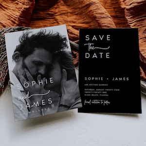 May include: Black and white wedding save-the-date cards. One card features a grayscale photo of a couple, with the names "Sophie and James" and the date. The other card is black with white text, announcing the wedding.