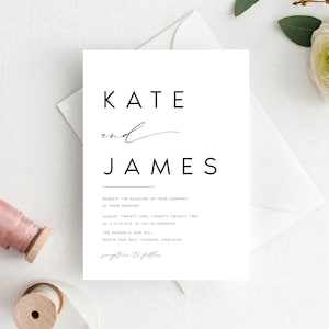 May include: A simple wedding invitation featuring the names "KATE" and "JAMES" in a contemporary font. The invitation includes event details and is set against a white background with a white envelope and floral accents.