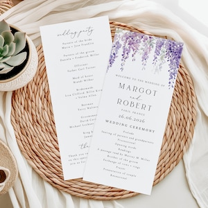 May include: Two white wedding programme cards with black text and a watercolour illustration of purple wisteria flowers at the top. The text includes the names Margot and Robert, the date 26.06.2026, Paris France, and a detailed wedding ceremony schedule.