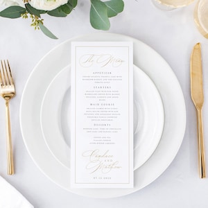 May include: A white wedding menu card with a gold border and gold text. The menu includes appetisers, starters, main course, desserts, and coffee and tea. The bottom of the card has the names Candace and Matthew and the date 07.12.2022.