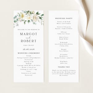May include: A sophisticated wedding program with floral detailing. The program includes the names "Margot and Robert", the date "26.06.2026", and the ceremony schedule. The right side lists the wedding party and a thank you message.